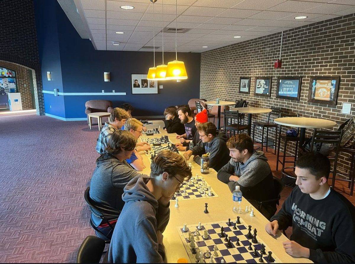 Students playing chess in the basement of Kirkhof